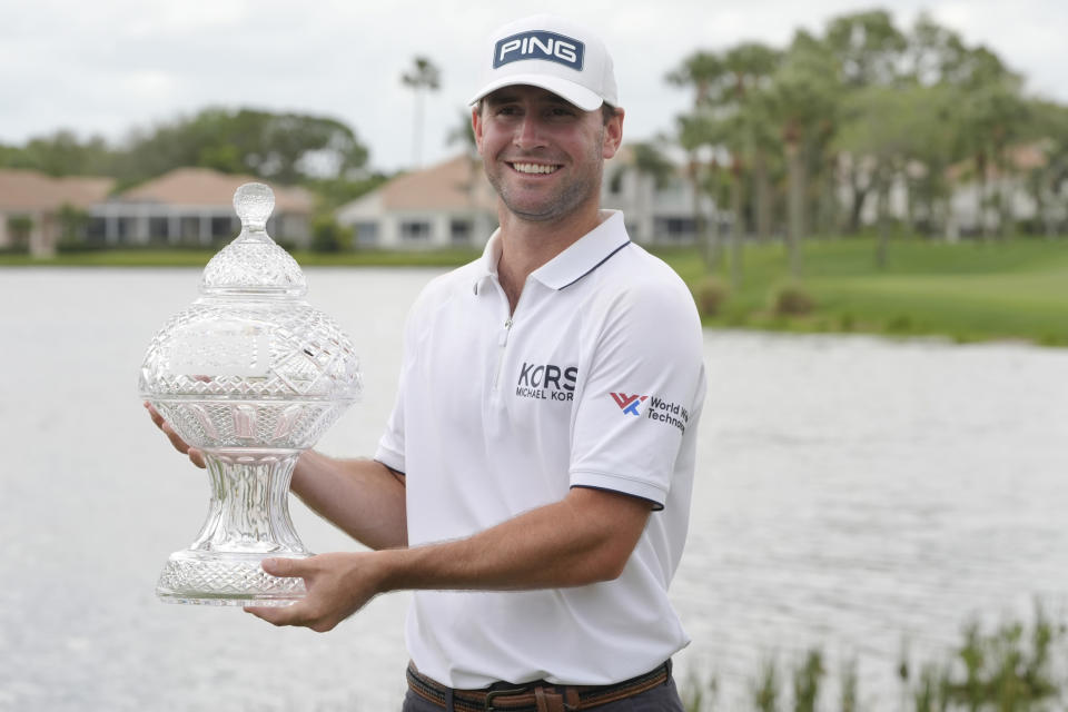 Austin Eckroat holds the Cognizant Classic trophy after the golf tournament, Monday, March 4, 2024, in Palm Beach Gardens, Fla. Eckroat got the first victory of his tour career Monday, topping Erik van Rooyen and Min Woo Lee by three shots to win the weather-delayed Cognizant Classic. (AP Photo/Marta Lavandier)