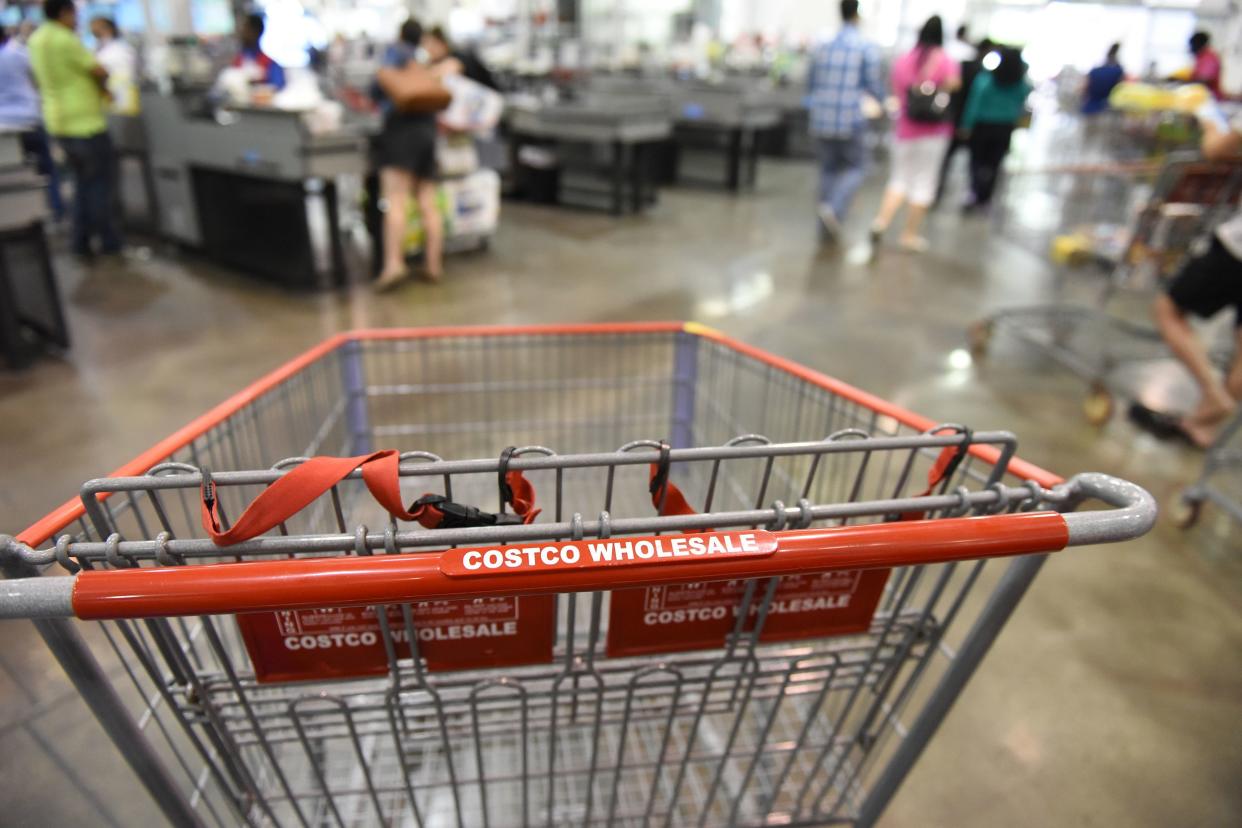 empty shopping cart at Costco in interior of store