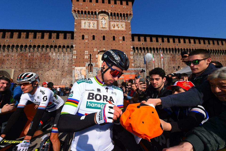 Peter Sagan signs authographs at the start of the 110th edition of the Milano-Sanremo cycling race in Milan, Italy, Saturday, March 23, 2019. Sagan finished fourth. (Dario Belinghieri/ANSA via AP)