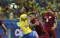 Brazil's Gabriel Jesus, left, controls the ball as Venezuela's Junior Moreno challenges him during a Copa America Group A soccer match at the Arena Fonte Nova in Salvador, Brazil, Tuesday, June 18, 2019. (AP Photo/Ricardo Mazalan)