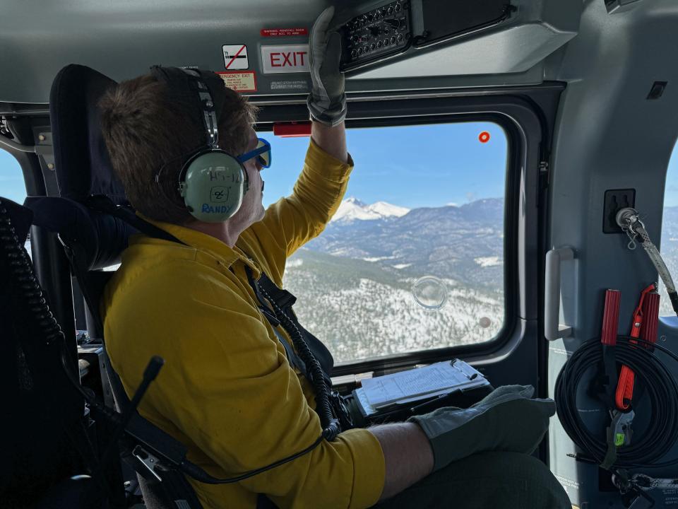 Erin Doyle, a wildfire operations specialist for the City of Boulder Fire Rescue, helped coordinate seven different audio frequencies between pilots and other partners Sunday.