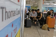 British passengers wait for news on cancelled Thomas Cook flights at Palma de Mallorca airport on Monday Sept. 23, 2019. Spain's airport operator AENA says that 46 flights have been affected by the collapse of the British tour company Thomas Cook, mostly in the Spanish Balearic and Canary archipelagos. (AP Photo/Francisco Ubilla)