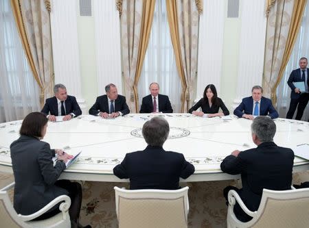 Russia's President Vladimir Putin, U.S. National Security Adviser John Bolton and members of the delegations attend a meeting in Moscow, Russia June 27, 2018. Sputnik/Alexei Druzhinin/Kremlin via REUTERS