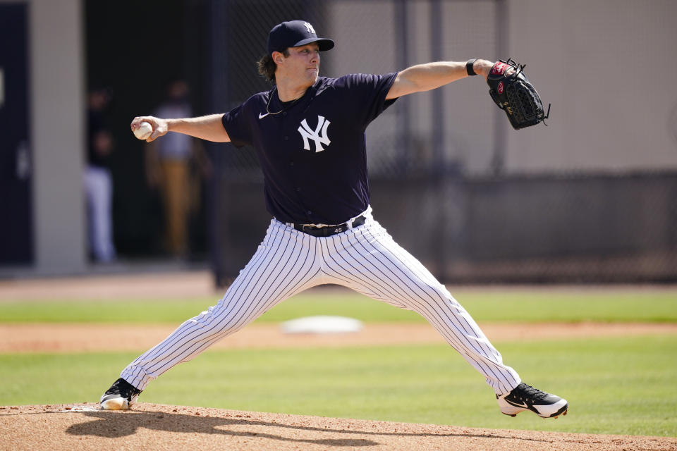 New York Yankees' Gerrit Cole delivers a pitch during a spring training baseball workout Monday, Feb. 22, 2021, in Tampa, Fla. (AP Photo/Frank Franklin II)