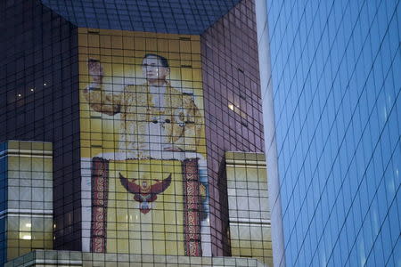 A picture of Thailand's King Bhumibol Adulyadej is seen on a bank building in Bangkok, Thailand April 1, 2016. REUTERS/Jorge Silva