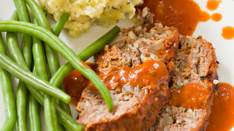 Meatloaf with sauce and sides