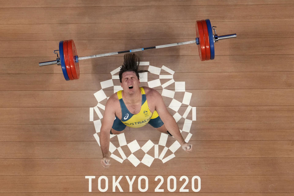 Matthew Ryan Lydement of Australia drops the barbel as he competes in the men's 109kg weightlifting event, at the 2020 Summer Olympics, Monday, Aug. 2, 2021, in Tokyo, Japan. (AP Photo/Luca Bruno)