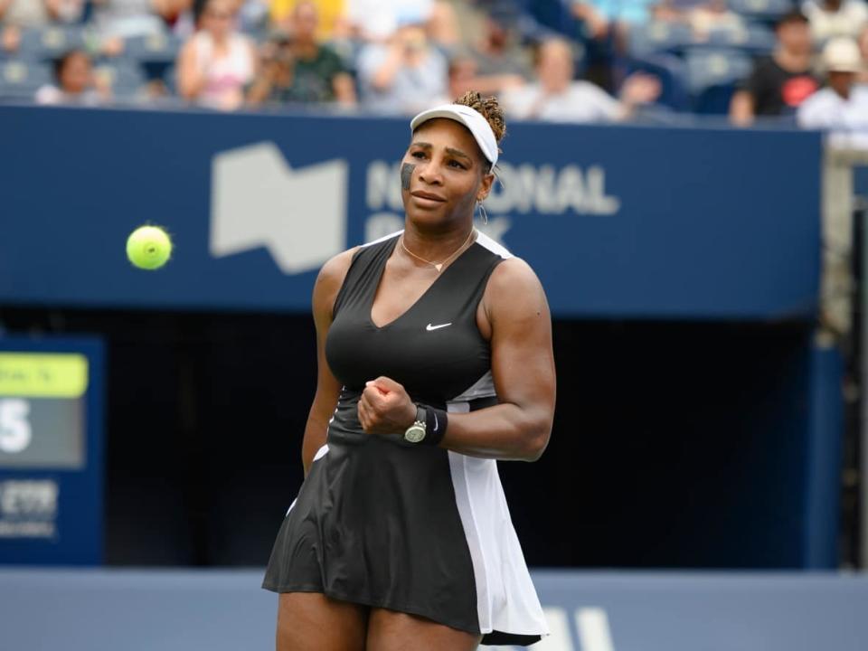 American tennis legend Serena Williams celebrates after defeating Nuria Parrizas-Diaz of Spain on Monday during her opening match of the National Bank Open women's tournament at Sobeys Stadium in Toronto. (Christopher Katsarov/The Canadian Press - image credit)