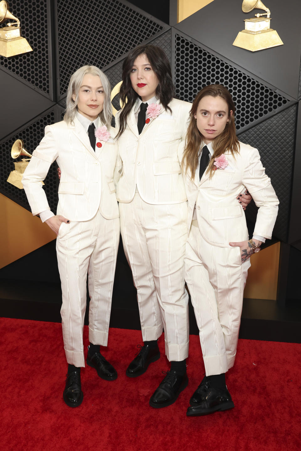 boygenius wearing matching thom browne at the Grammys.  (Image via Getty Images)