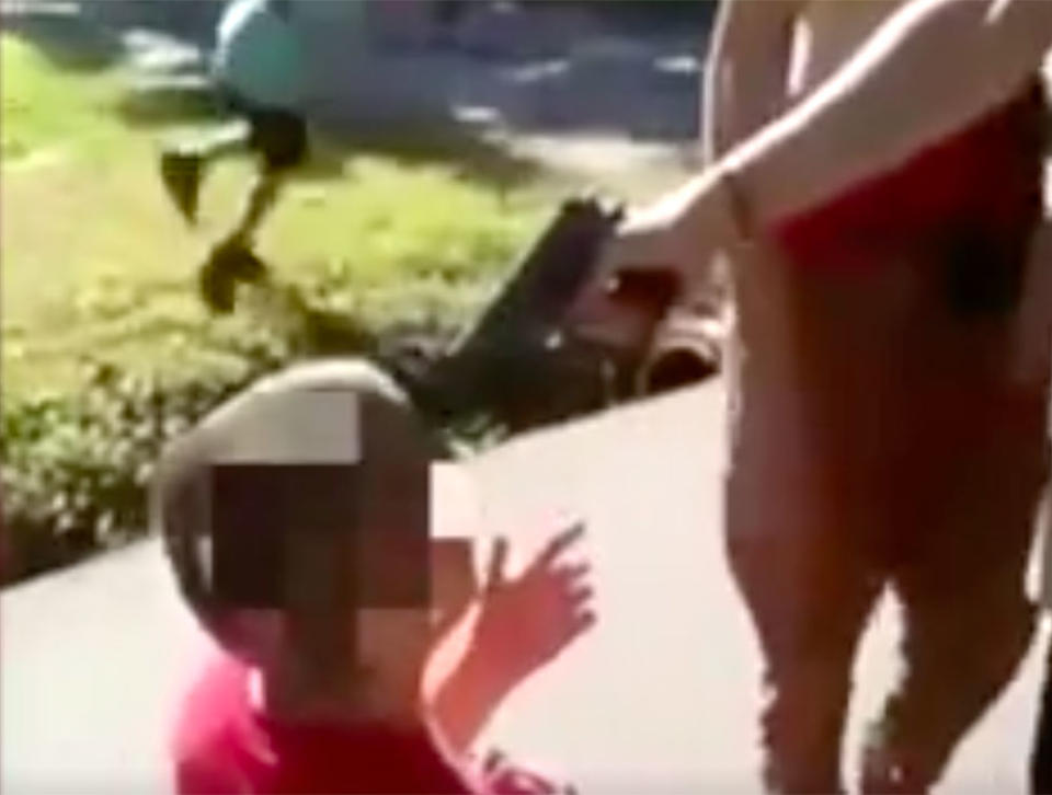 Distressing footage shows the young boy kneeling before someone can be seen holding a gun near his head in Independence, Missouri. Source: FOX 4 KC