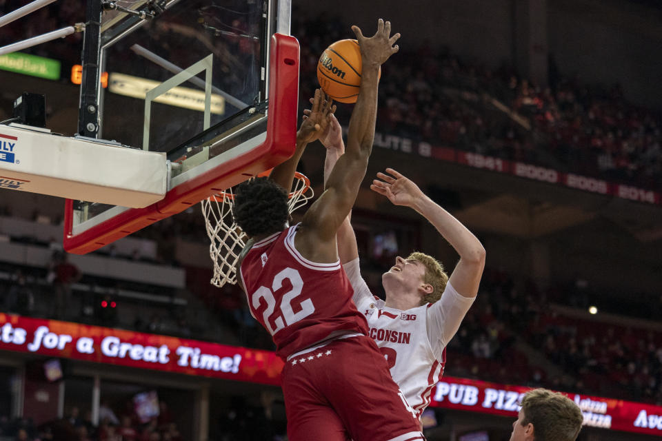 Wisconsin's Steven Crowl, right, fouls Indiana's Jordan Geronimo (22) during the first half of an NCAA college basketball game Wednesday, Dec. 8, 2021, in Madison, Wis. (AP Photo/Andy Manis)