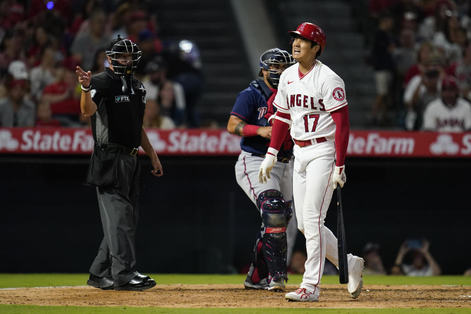 Los Angeles Angels designated hitter Shohei Ohtani (17) reacts after swinging a strike during the sixth inning of a baseball game against the Minnesota Twins in Anaheim, Calif., Friday, Aug. 12, 2022. (AP Photo/Ashley Landis)