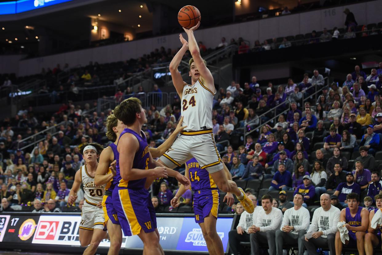 Harrisburg's guard Jacoby Mehrman (24) shoots the ball on Thursday, March 14, 2024 at Denny Sanford Premier Center in Sioux Falls.