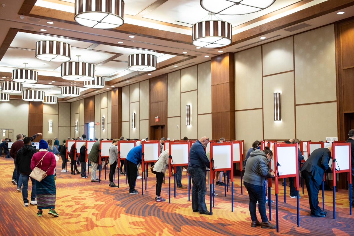 Voters cast their ballots at the Louisville Marriott East polling location on Nov. 2, 2020.