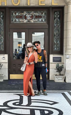 <p>Braunwyn Windham Burke/Instagram</p> Braunwyn Windham-Burke (left) and Jennifer Spinner pose in front of a Nashville hotel.