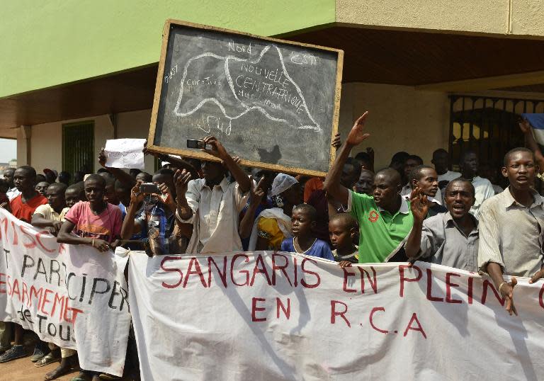 Central Africa's Muslims, accusing French soldiers of siding with the country's Christian population, demonstrate in the PK0 neighborhood in Bangui on December 24, 2013