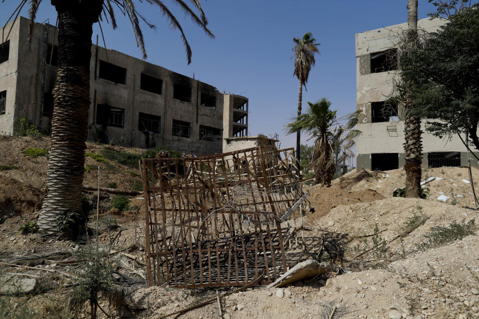 In this July 15, 2018 photo, a cage used by the Army of Islam for prisoners is abandoned Tawbeh Prison, in Douma, near the Syrian capital Damascus, Syria. The fate of activist Razan Zaitouneh is one of the longest-running mysteries of Syria’s civil war. There’s been no sign of life, no proof of death since gunmen abducted her and three of her colleagues from her offices in the rebel-held town of Douma in 2013. Now Douma is in government hands and clues have emerged that may bring answers. (AP Photo/Hassan Ammar)