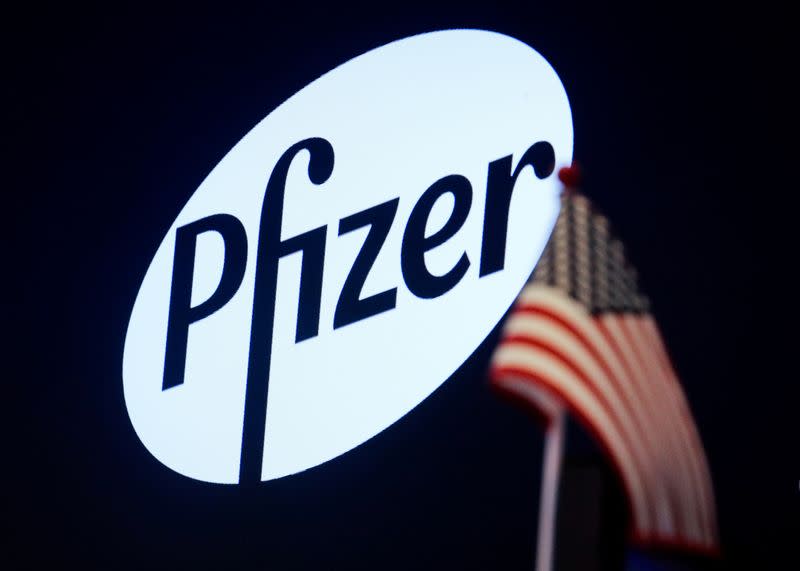 A logo for Pfizer is displayed on a monitor on the floor at the NYSE in New York