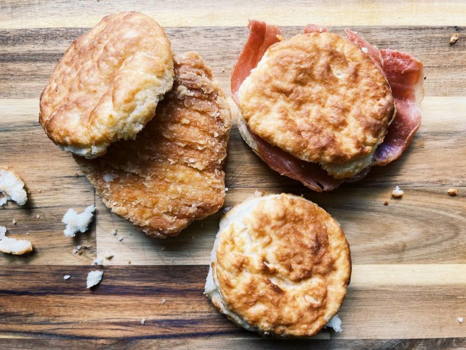 The iconic fast-food chain Bojangles, based in Charlotte, is known for its chicken sandwiches and biscuits. Pictured are a cajun fillet biscuit (left), a country ham biscuit (right), and a plain made-from-scratch biscuit (bottom)