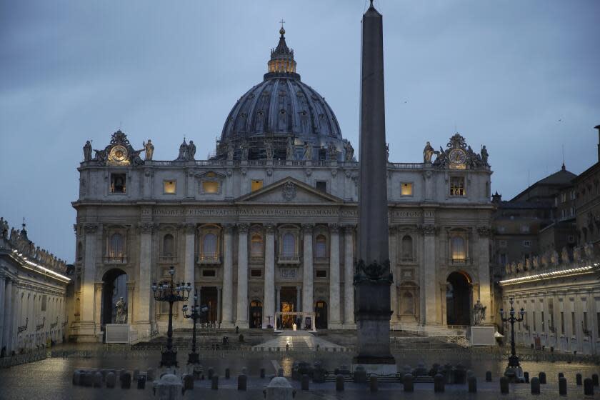 FILE - In this file photo taken on March 27, 2020, Pope Francis delivers the Urbi and Orbi prayer in an empty St. Peter's Square, at the Vatican. If ever there was a defining moment of Pope Francis during the coronavirus pandemic, it came on March 27, the day Italy recorded its single biggest daily jump in fatalities. From the rain-slicked promenade of St. Peter's Basilica, Francis said the virus had shown that we're all in this together, that we need each other and need to reassess our priorities. (AP Photo/Alessandra Tarantino, File)