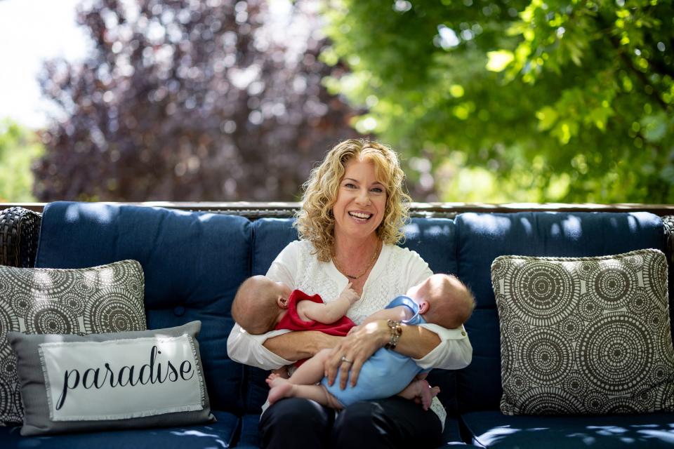 Cindy Davis poses for a photo with her twin 9-week-old granddaughters Indy and Oakley while babysitting them at her home in Cedar Hills on Tuesday, Aug. 15, 2023. | Spenser Heaps, Deseret News