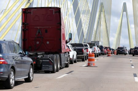 Greenpeace USA climbers form a blockade on the Fred Hartman Bridge, near Baytown