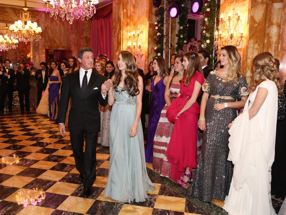 Sylvester Stallone accompanies his daughter Sophia Rose onto the Le Bal dance floor in 2012.