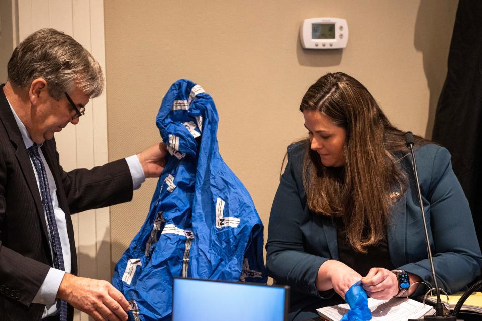 Prosecutor John Meadors shows a blue jacket to his witness Megan Fletcher, SLED forensic scientist in the double murder trial of Alex Murdaugh at the Colleton County Courthouse in Walterboro. Andrew J. Whitaker/The Post and Courier/Pool