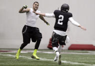 Texas A&M quarterback Johnny Manziel (2) and wide receiver Mike Evans celebrate after a pass reception during a drill at pro day for NFL football representatives in College Station, Texas, Thursday, March 27, 2014. (AP Photo/Patric Schneider)