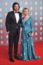 <p>Adam Driver wore a black tux, while wife Joanne Tucker chose a patterned teal look.</p>