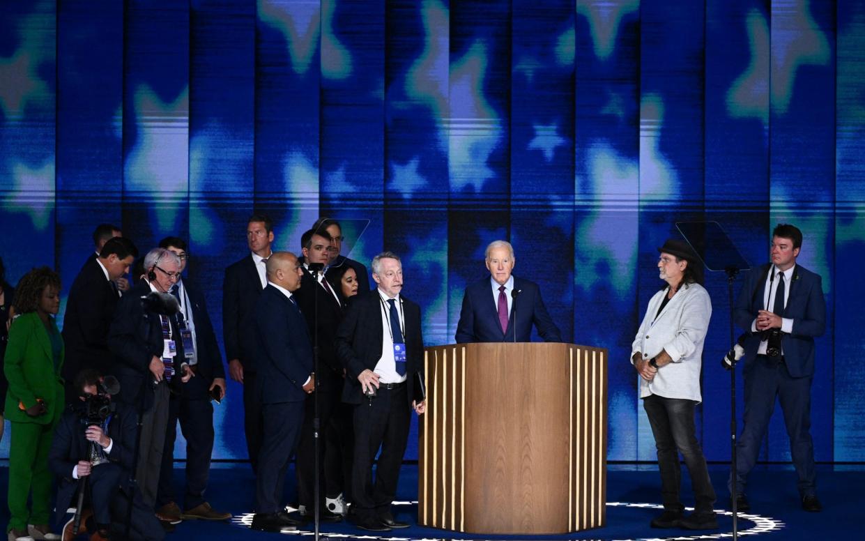 US President Joe Biden does a stage check before the start of the first day of the Democratic National Convention in Chicago