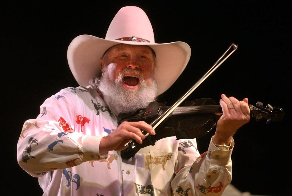 Wilmington native Charlie Daniels plays the fiddle in downtown Tuscaloosa, Alabama, in 2015.