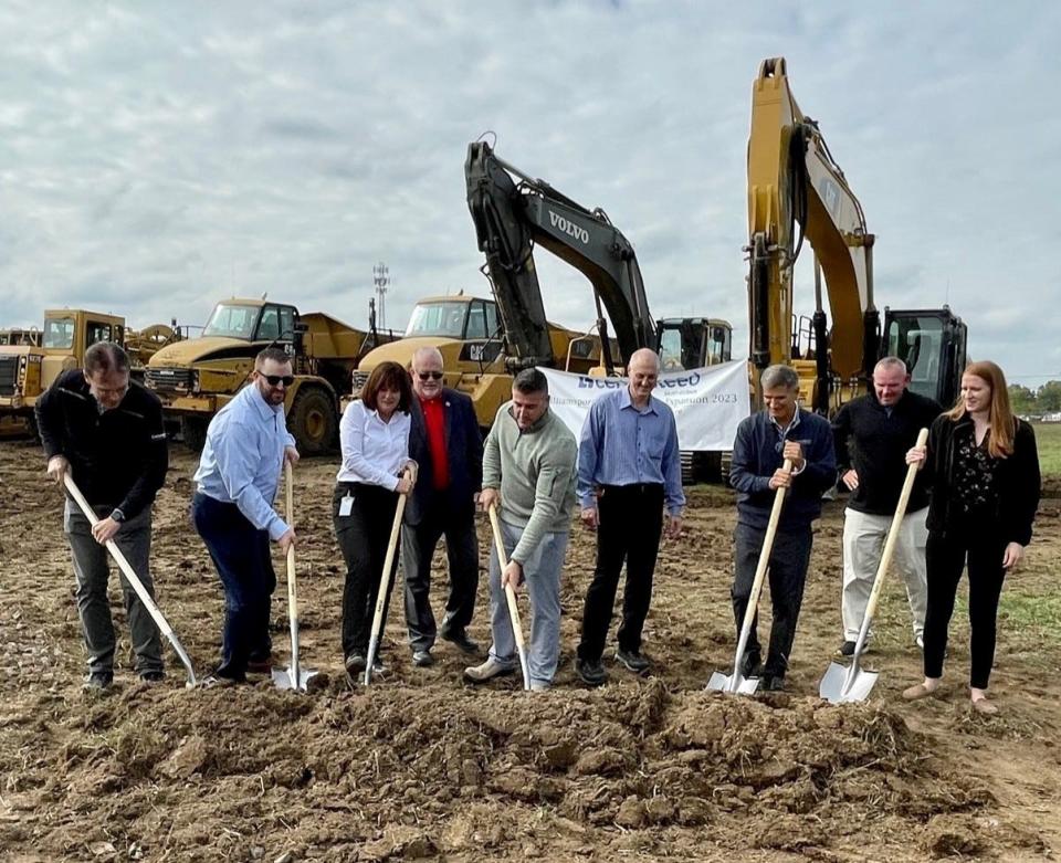 Employees of Saint-Gobain North America and Washington County Commissioner Jeff Klein grab shovels last week to break ground on the site of CertainTeed Siding’s new plant in Williamsport.