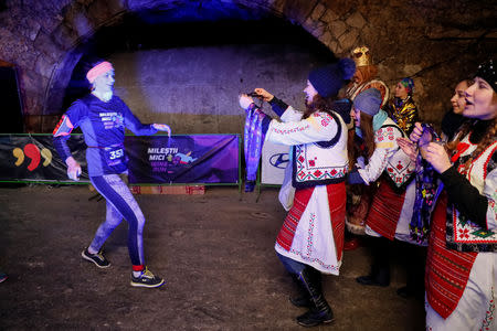 A participant finishes the "Milestii Mici Wine Run 2019" race, at a distance of 10 km in the world's largest wine cellars in Milestii Mici, Moldova January 20, 2019. Picture taken January 20, 2019. REUTERS/Gleb Garanich