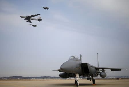 A U.S. Air Force B-52 flies over Osan Air Base in Pyeongtaek, South Korea, January 10, 2016. REUTERS/Kim Hong-Ji