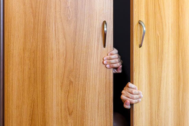 <p>getty</p> A stock image of hands reaching out of a cabinet