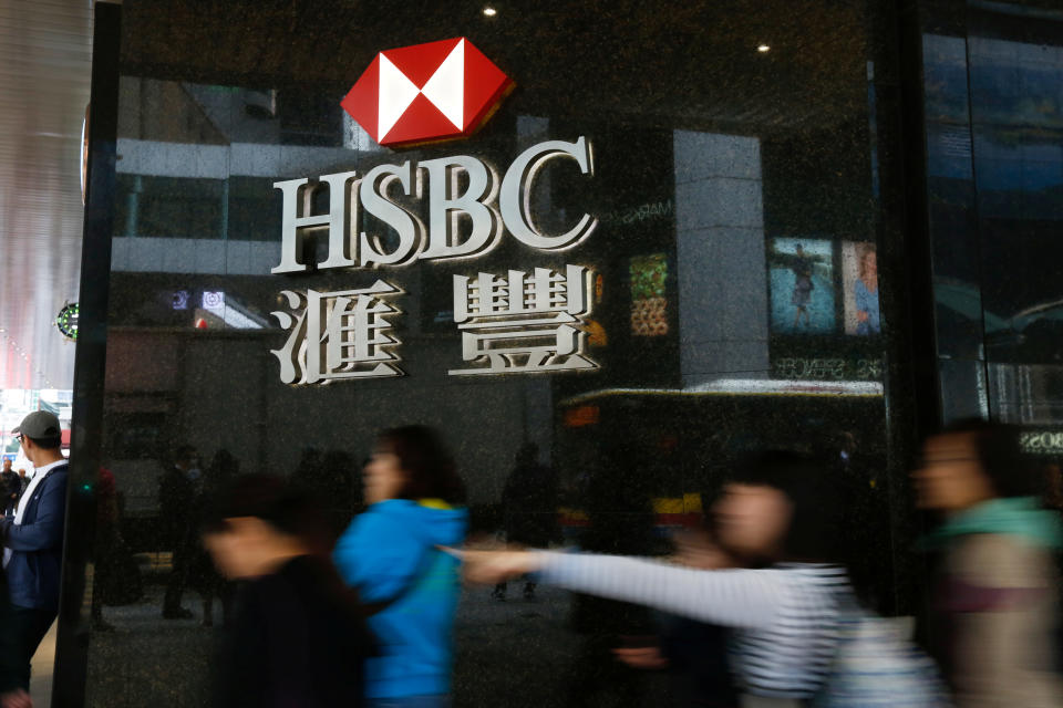 People walk past a branch of HSBC at the financial Central district in Hong Kong. (Photo: REUTERS/Bobby Yip)