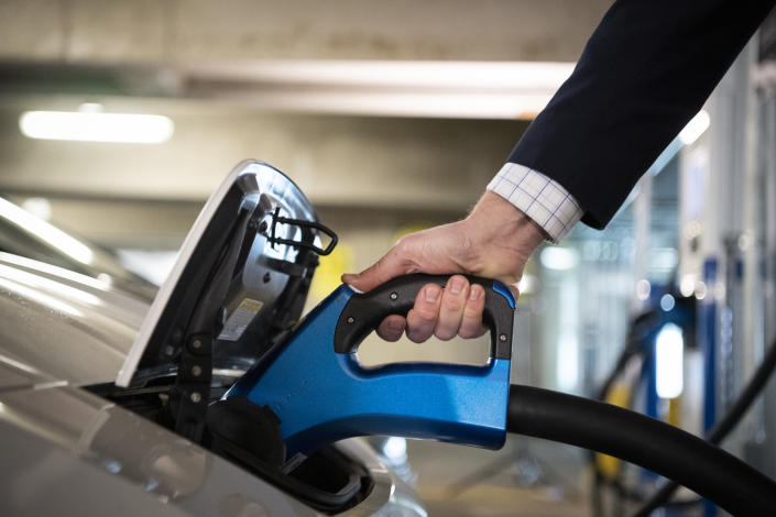 UNITED STATES - April 22: A person charges an electric vehicle at an EVgo charging station at Union Station in Washington on Thursday, April 22, 2021. (Photo by Caroline Brehman/CQ-Roll Call, Inc via Getty Images)