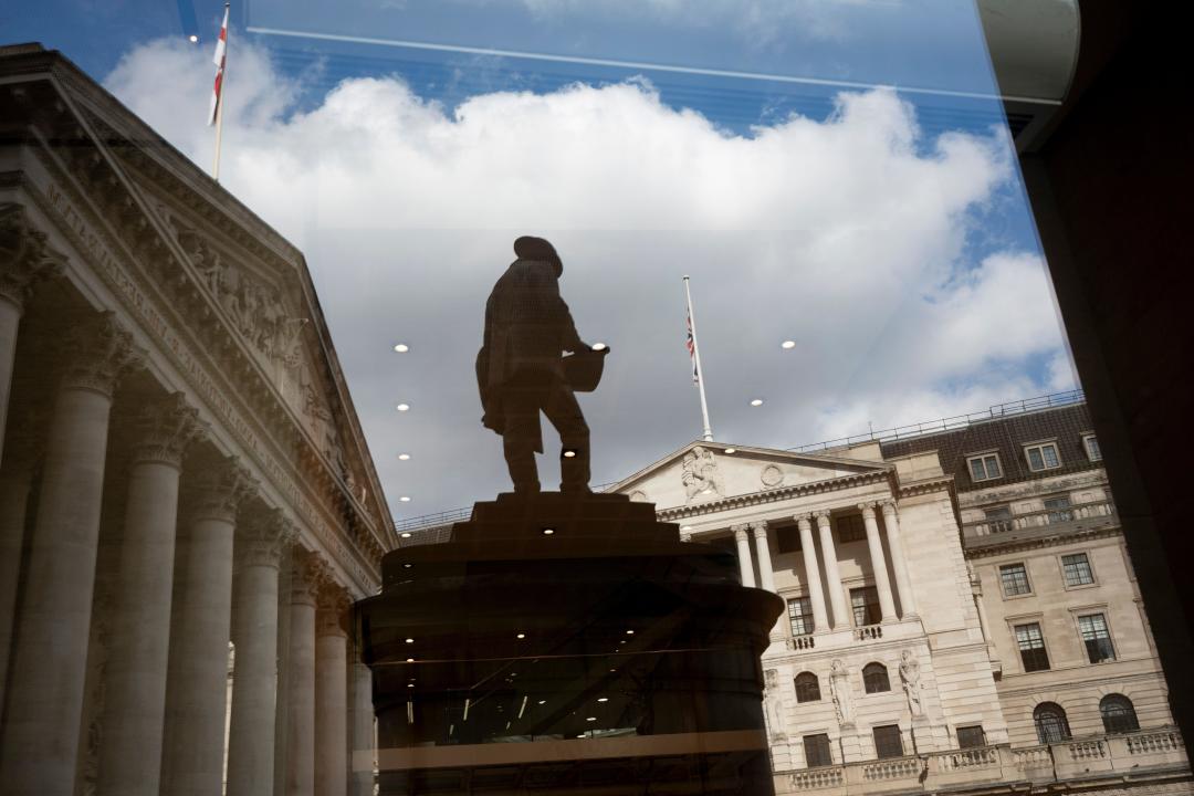 Reflected in a nearby corporate window are the silhouetted statue of civil engineer James Henry Greathead, the Bank of England (right) and Royal Exchange (left) in the City of London, the capital's historic financial district (aka 'The Square Mile'), on 4th October 2024, in London, England.