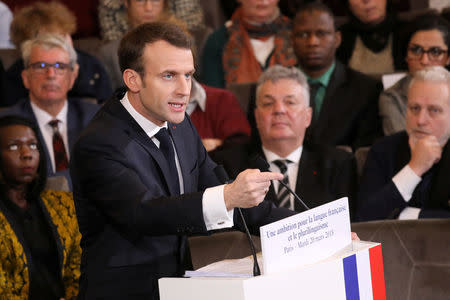 France's President Emmanuel Macron gives a speech to unveil his strategy to promote French language as part of the International Francophonie Day, before members of the French Academy and other guests, at the French Institute in Paris, France, March 20, 2018. Ludovic Marin/Pool via REUTERS