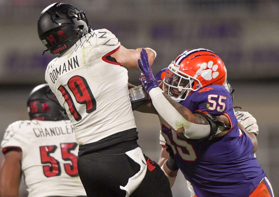 Clemson defensive tackle Payton Page (55) pressures Louisville quarterback Brock Dormann (19) during the third quarter at Memorial Stadium in Clemson, South Carolina Saturday, Nov. 12, 2022.   