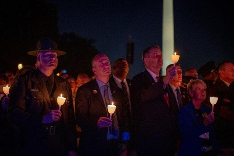 From left, U.S. Border Patrol Deputy Chief of Operations
Tony Barker, U.S. Customs and Border Protection Acting
Commissioner Troy Miller, and CBP Acting Deputy Commissioner Benjamine
“Carry” Huffman pay tribute to fallen agents at a vigil in 2021.