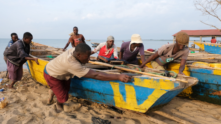 Fisherman push a boat up the beach of Lake Tanganyika in Bujumbura, Burundi - Wednesday 16 March 2022