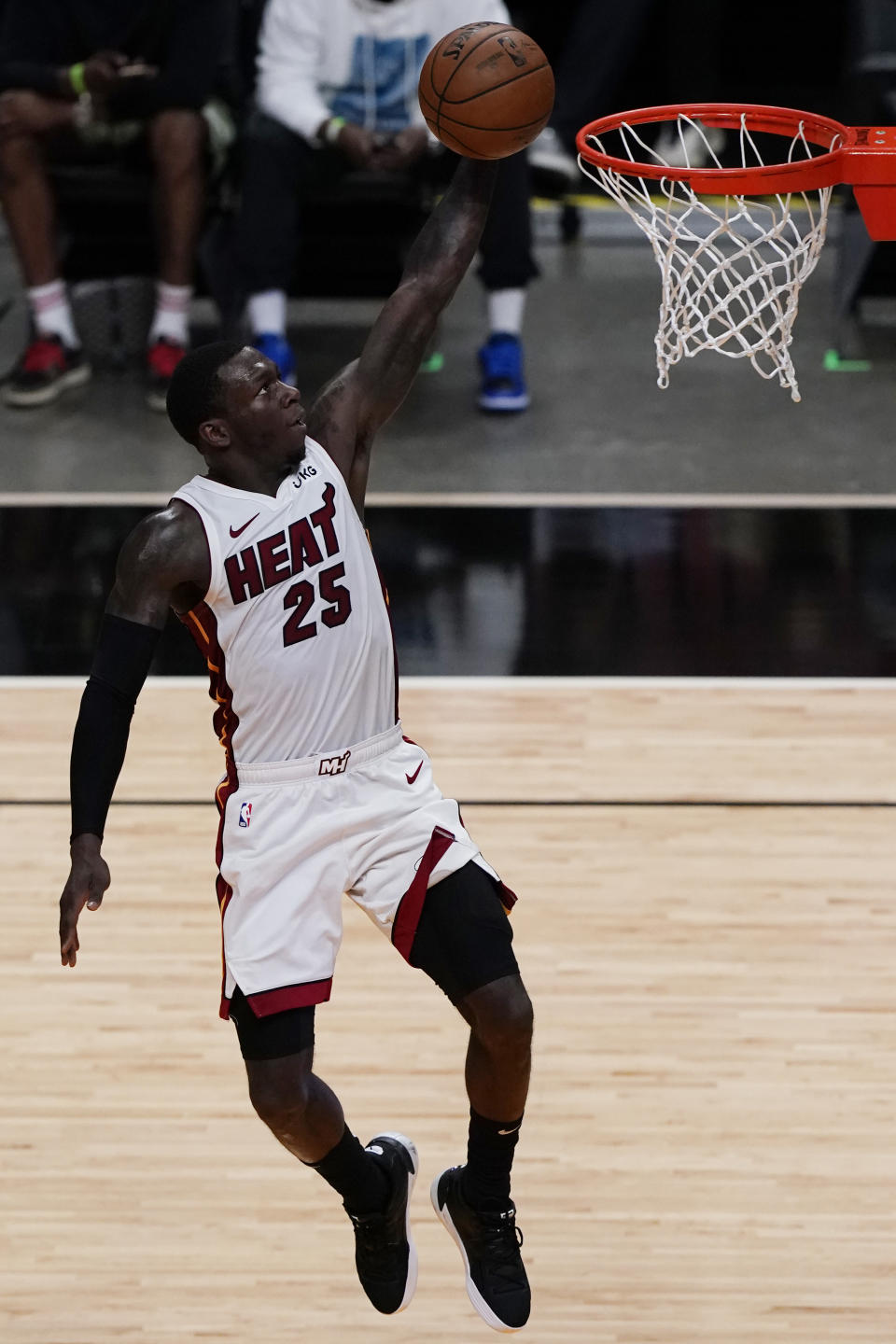 Miami Heat guard Kendrick Nunn (25) drives to the basket during the second half of an NBA basketball game against the Houston Rockets, Monday, April 19, 2021, in Miami. The Heat defeated the Rockets 113-91. (AP Photo/Marta Lavandier)
