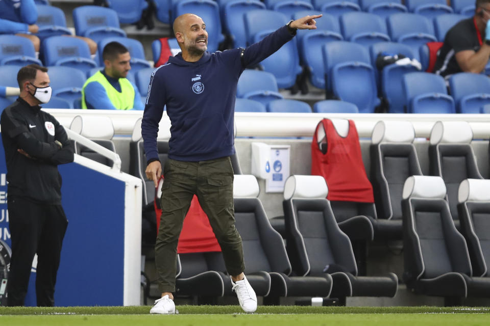 Manchester City's head coach Pep Guardiola gestures during the English Premier League soccer match between Brighton and Manchester City at the Falmer stadium in Brighton, England, Saturday, July 11, 2020. (Julian Finney/Pool via AP)