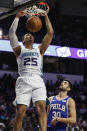 Charlotte Hornets forward PJ Washington (25) dunks over Philadelphia 76ers guard Furkan Korkmaz (30) in the second half of a preseason NBA basketball game in Winston-Salem, N.C., Friday, Oct. 11, 2019. (AP Photo/Nell Redmond)