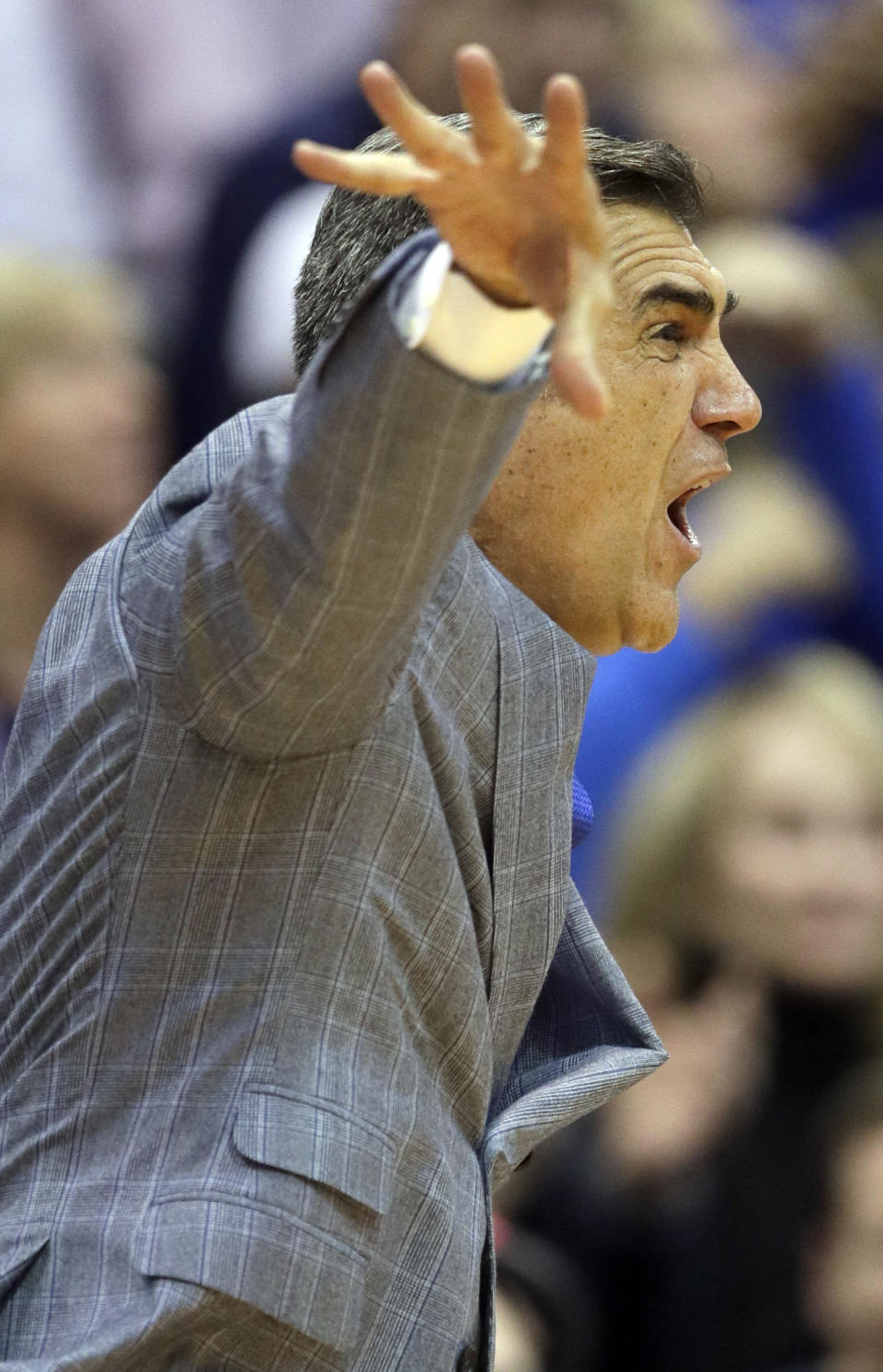 Villanova head coach Jay Wright works the side lines during the first half of an NCAA college basketball game against Kansas in Lawrence, Kan., Saturday, Dec. 15, 2018. (AP Photo/Orlin Wagner)