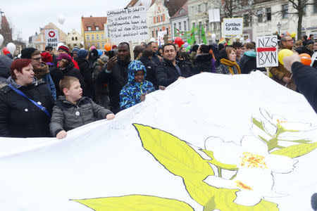 People attend a demonstration against discrimination of migrants in Cottbus, Germany February 3, 2018. REUTERS/Hannibal Hanschke