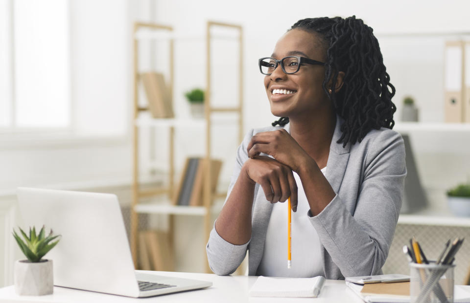 Business Career Concept. Afro Businesswoman Smiling Sitting In Modern Office. Copy Space