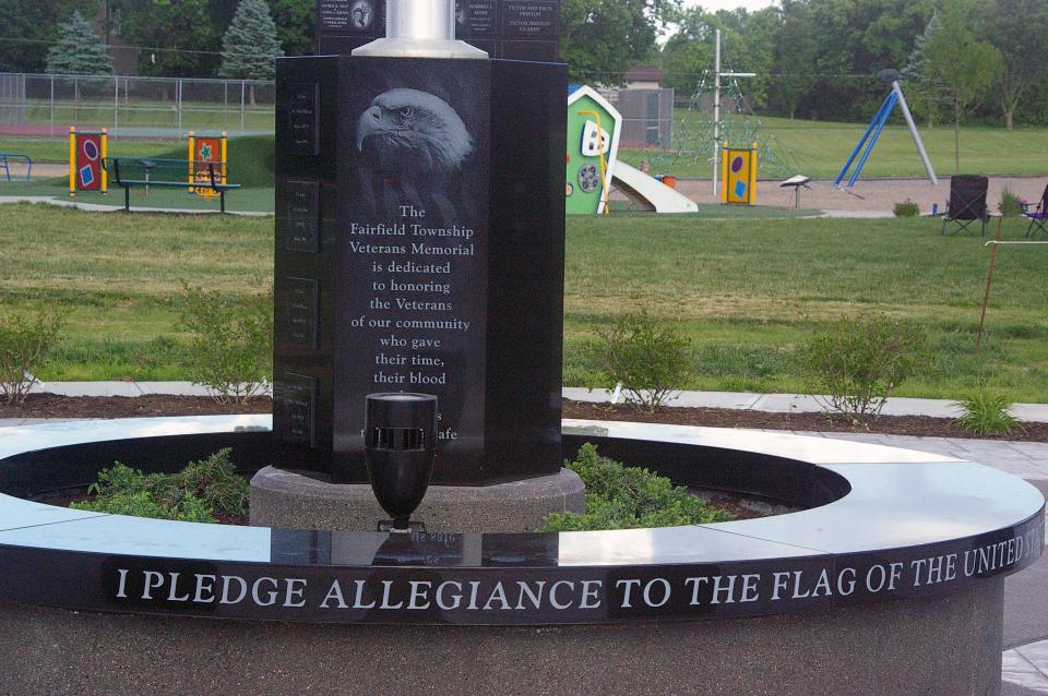 A stone and hexagon granite planter is featured in the circular plaza of the Fairfield Township Veterans Memorial in Heroes Park.